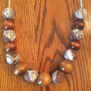 Wood and fabric covered beaded necklace.